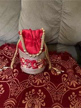 Red Embroidered Drawstring Potli Clutch with Gold Bead Handle
